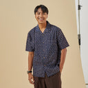 Relaxed fit batik shirt worn as beach resort wear