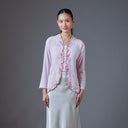 Mandalas embroidered kebaya in a deep red tone associated with coastal batik